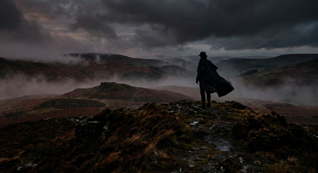 Moody moors landscape with a single figure in dark romantic attire silhouette standing on windswept hills. Deep reds and blacks, misty fog atmosphere, cinematic lighting. The figure wears a flowing dark cape or Victorian-inspired coat. No faces visible. D