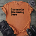 Currently Becoming Lore T-Shirt