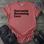 Currently Becoming Lore T-Shirt